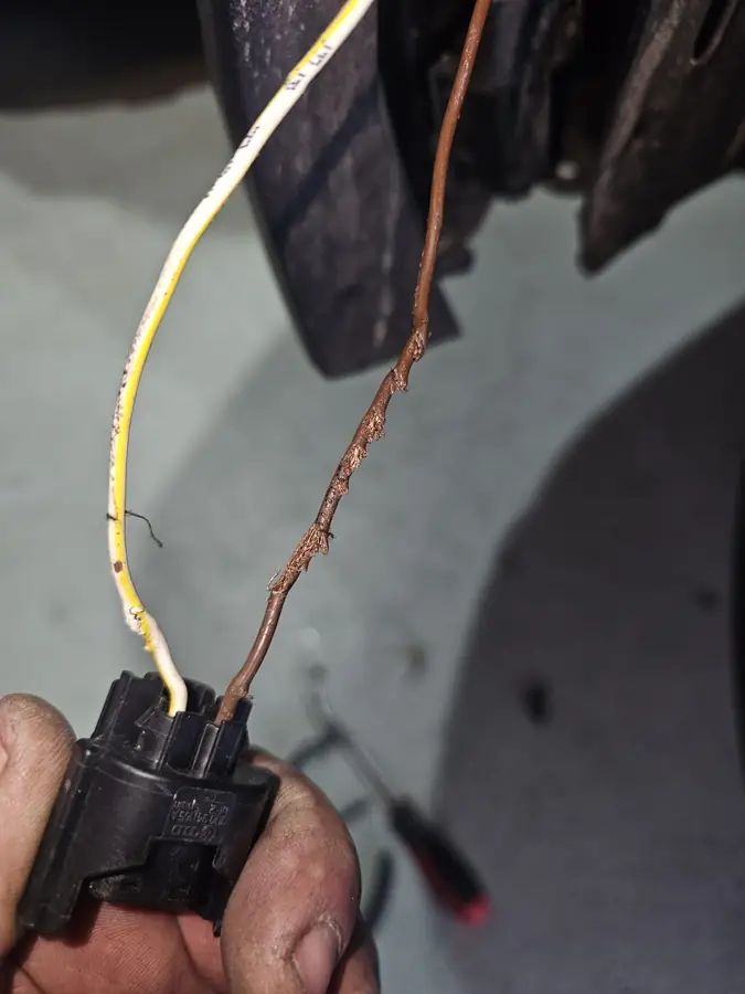 Chafed wiring loom repaired at the roadside