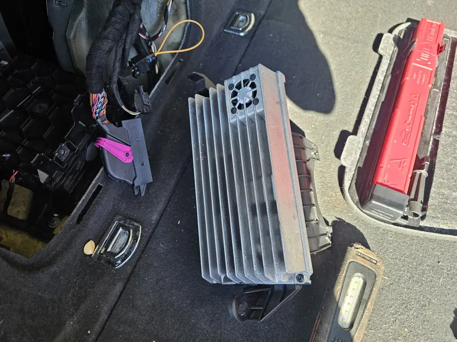 Amplifier module removed from a vehicle for testing