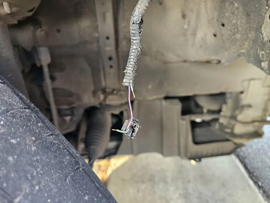 Trailer wiring loom repaired under a tow ute