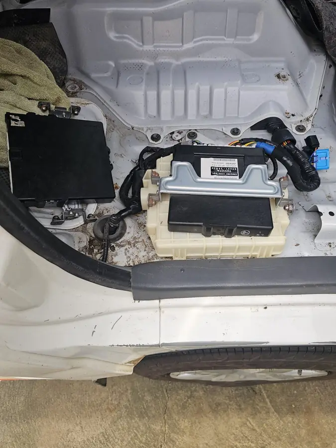 New car battery fitted in an engine bay by mobile auto electrician in Canberra